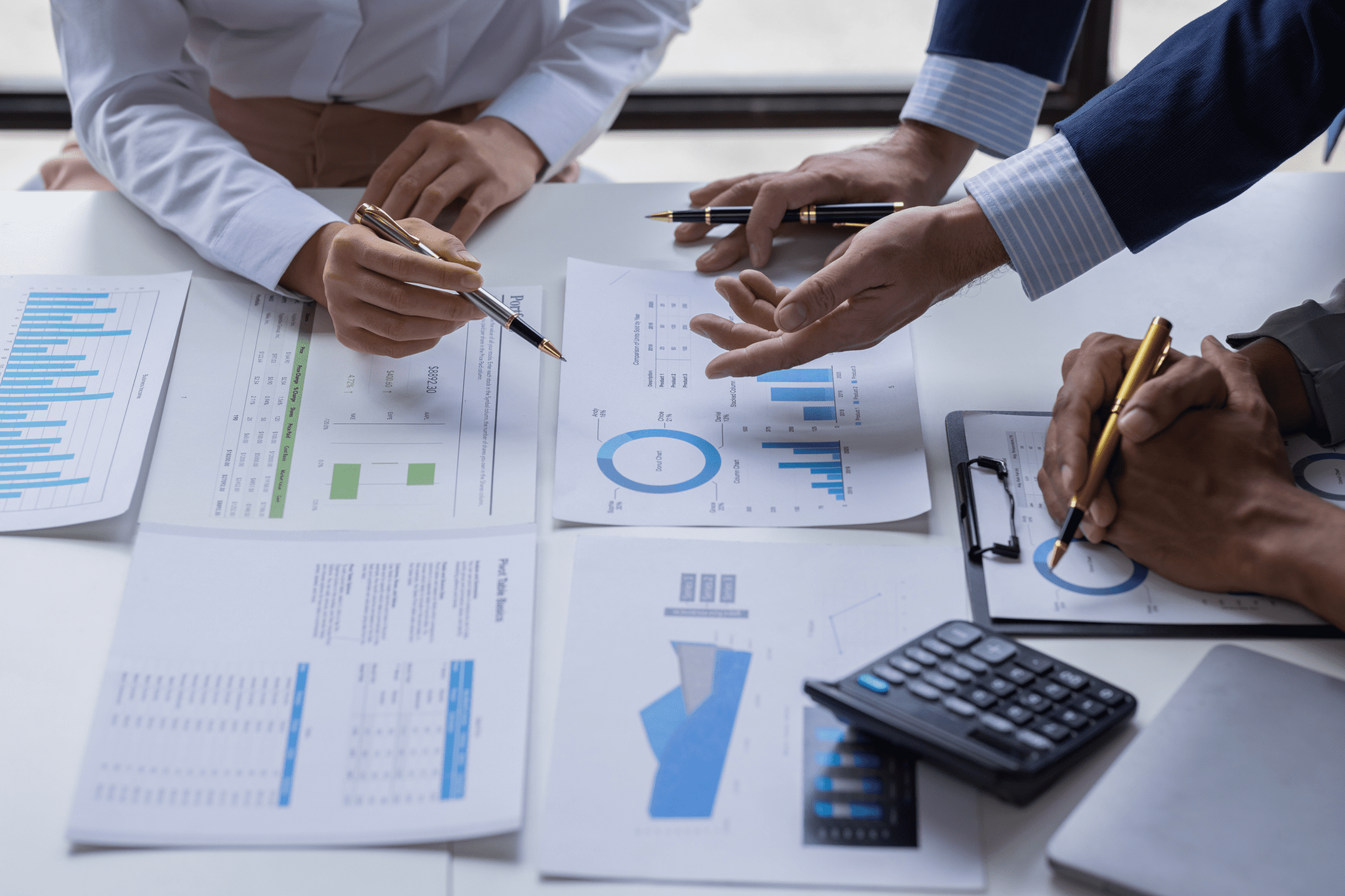 Business meeting with charts and graphs.